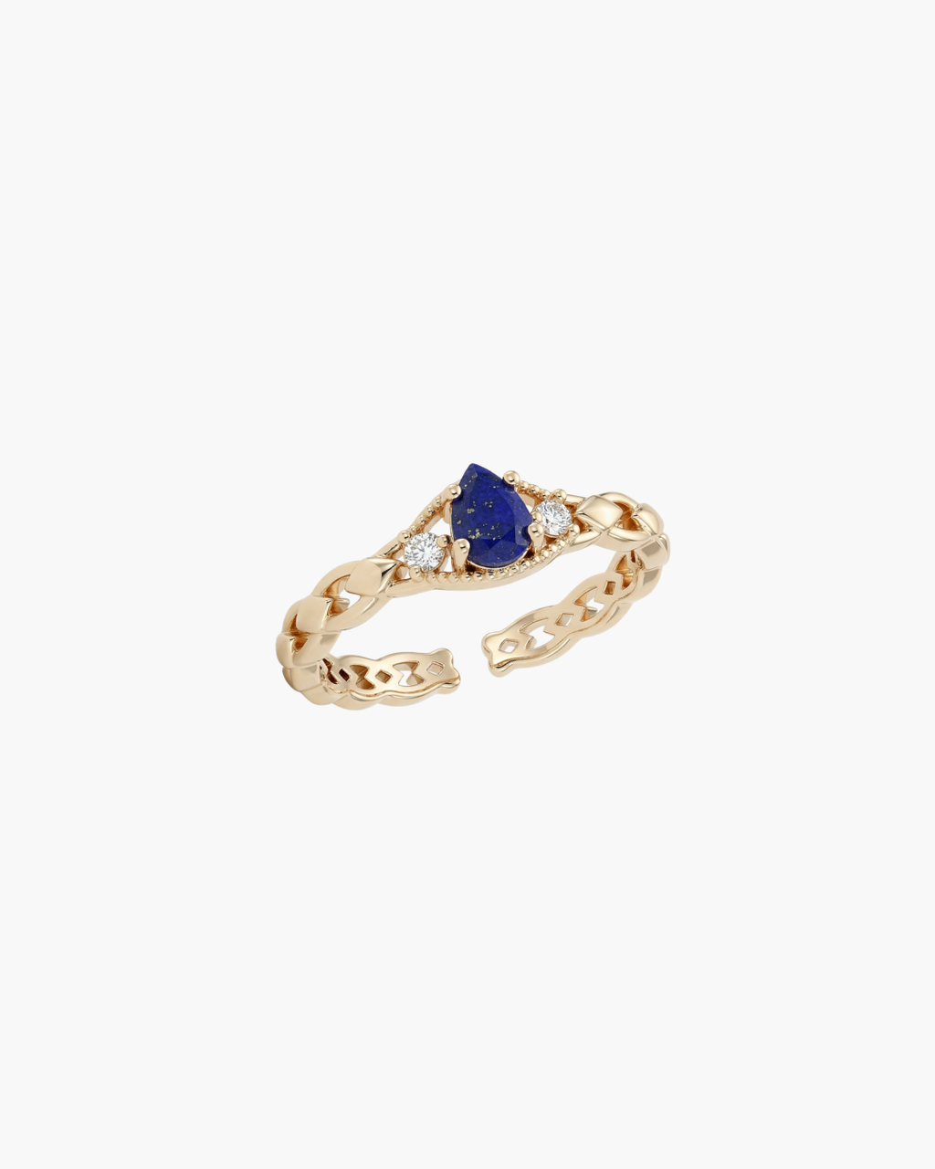 Macro view of a gold-plated S925 silver ring with a central teardrop-shaped blue lapis lazuli stone and two sparkling zircons on a textured band.