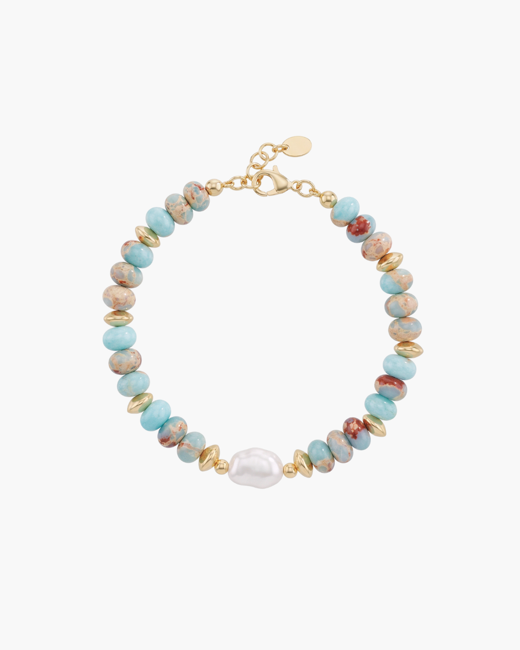 Top view of a beaded bracelet with turquoise blue Shoushan stones, golden spacers, and a central white baroque pearl on a white ceramic vase.