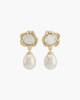Macro shot of molten gold earrings with white mother of pearl center and teardrop pearl dangles.