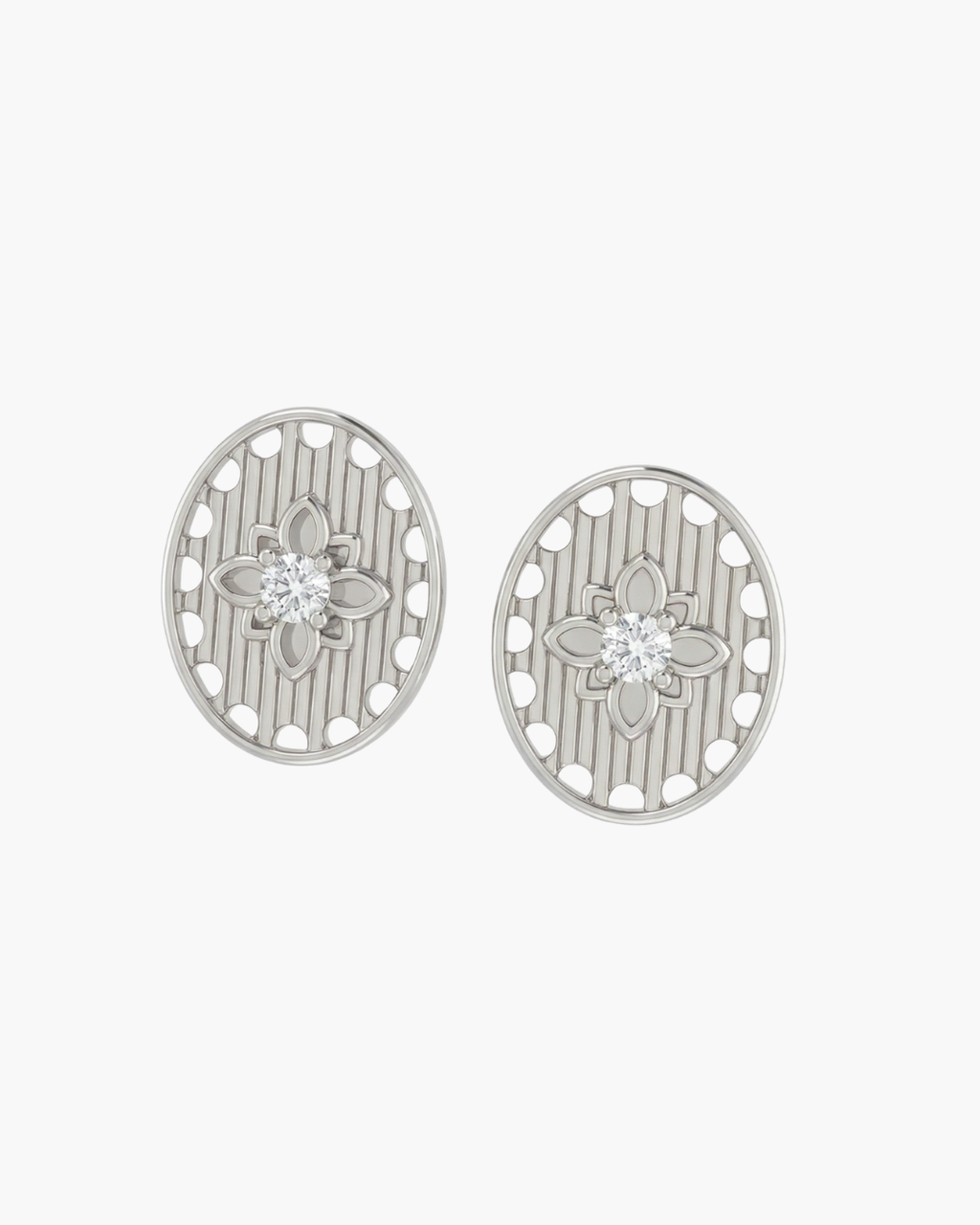 Overhead view of vintage gold Art Deco shield earrings with micro-paved zircons and rhythmic linear patterns on a white background.
