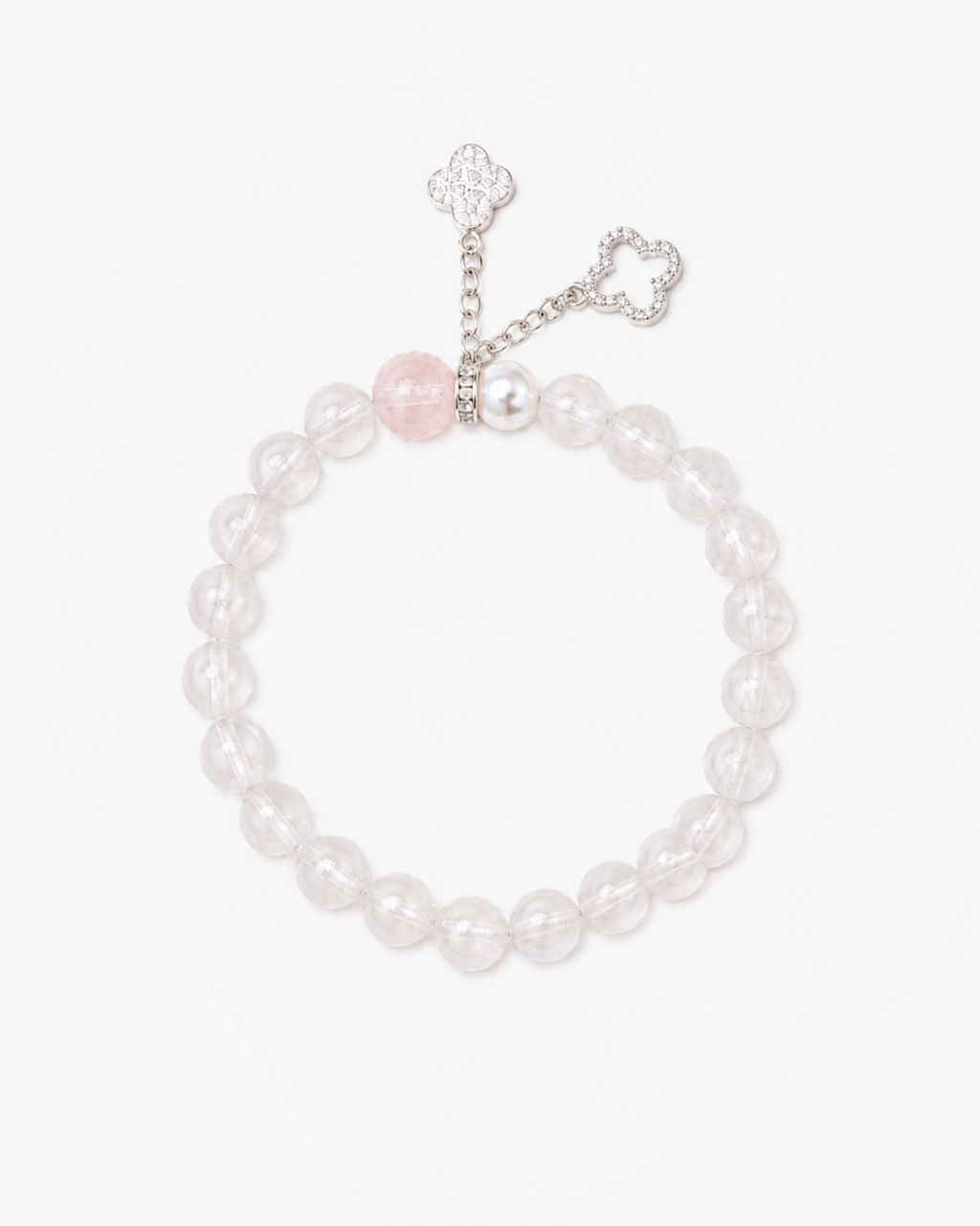 Invite sweet luck with our Four-Leaf Clover Tassel Bracelet. Features natural rose quartz, a radiant pearl, and sparkling CZ dangles in solid S925 silver.